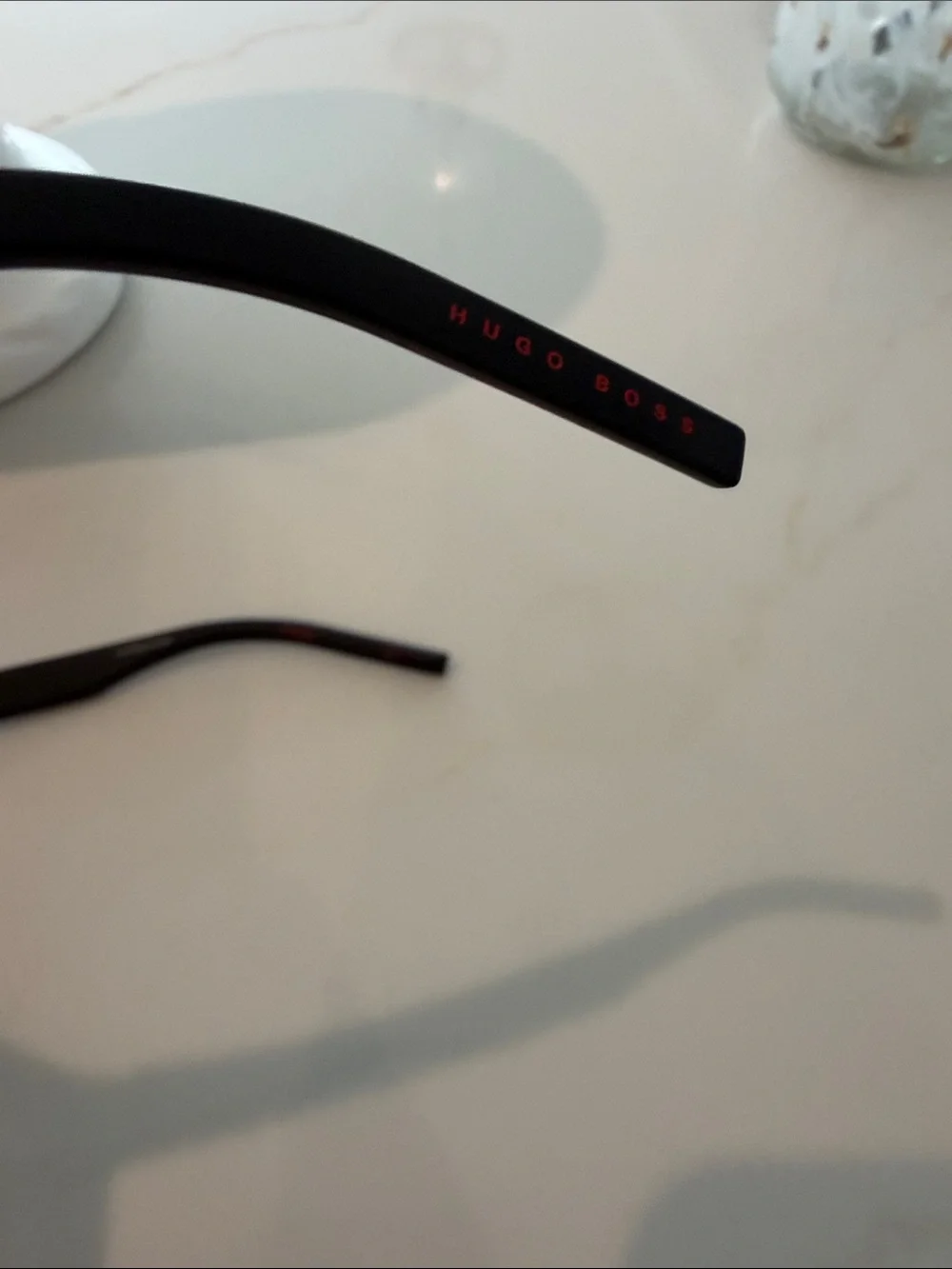 HUGO Men’s Black Sunglasses (recycled nylon) with Red-Orange Mirrored Lenses.
